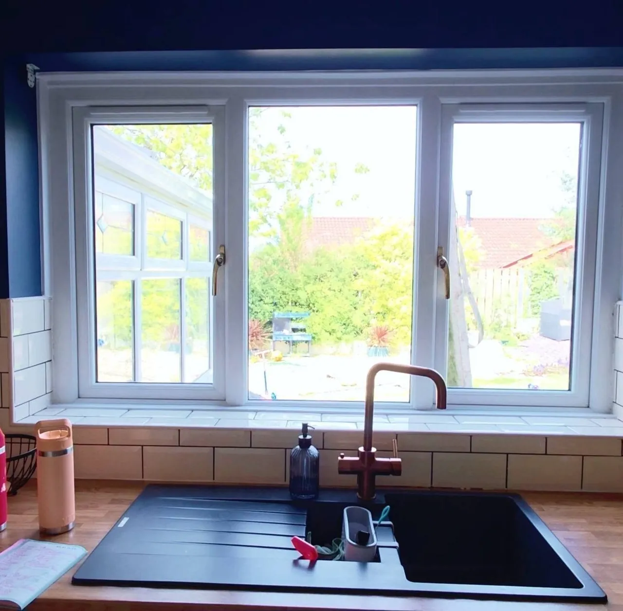 White uPVC kitchen window above a sink