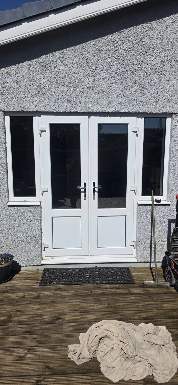 Old white French doors before double glazing replacement