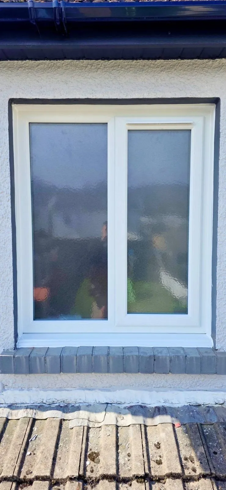 White uPVC window with obscure glass, exterior view