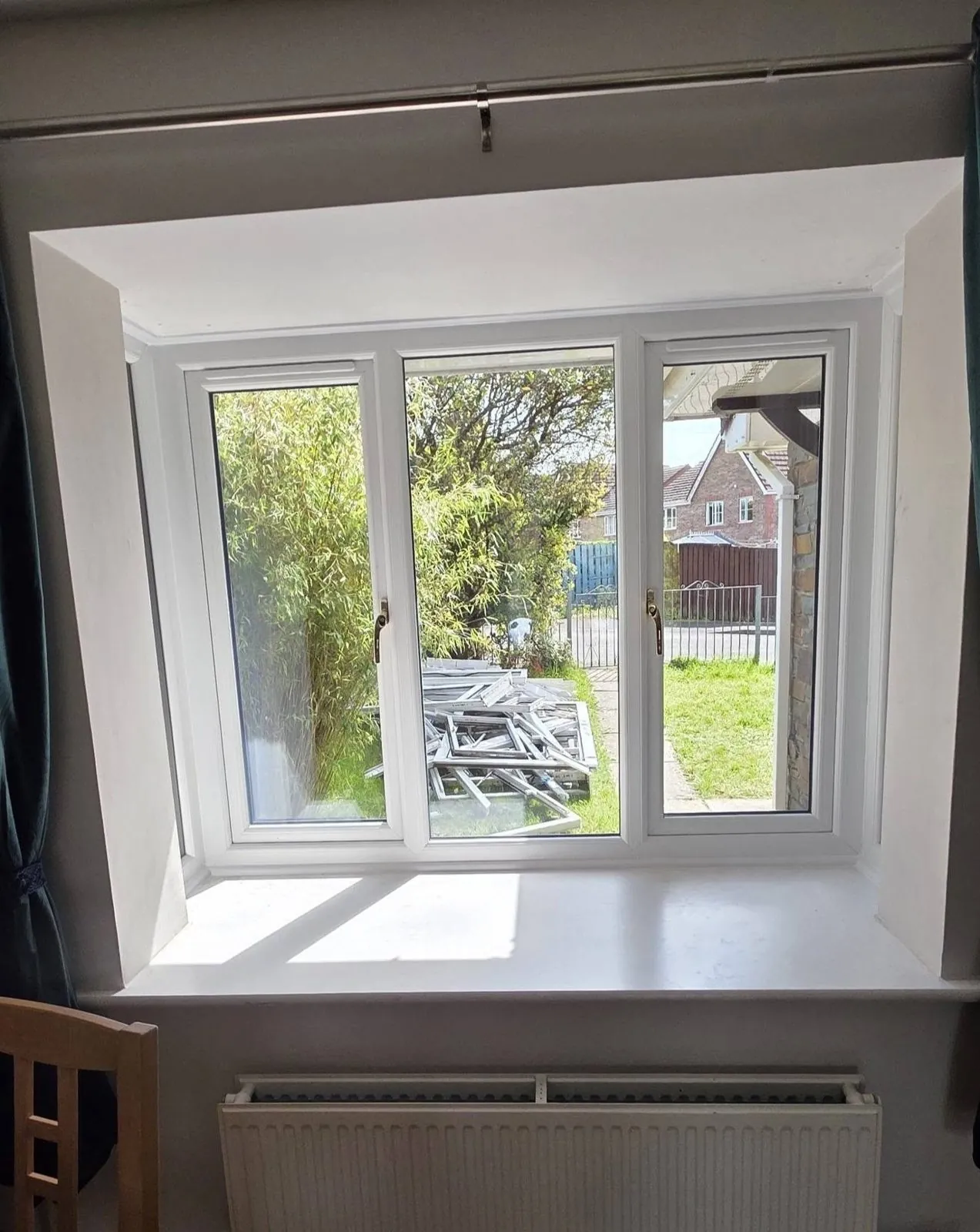 White uPVC three-pane window, interior view
