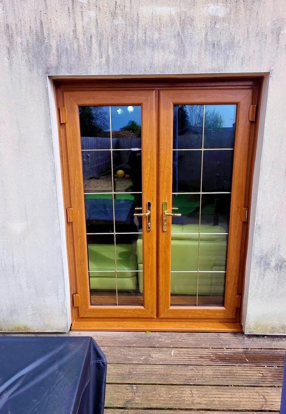 Oak effect double glazed French doors with Georgian bars, exterior view