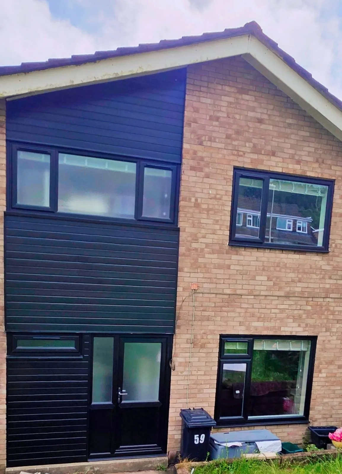 House with new black double glazed windows and back door