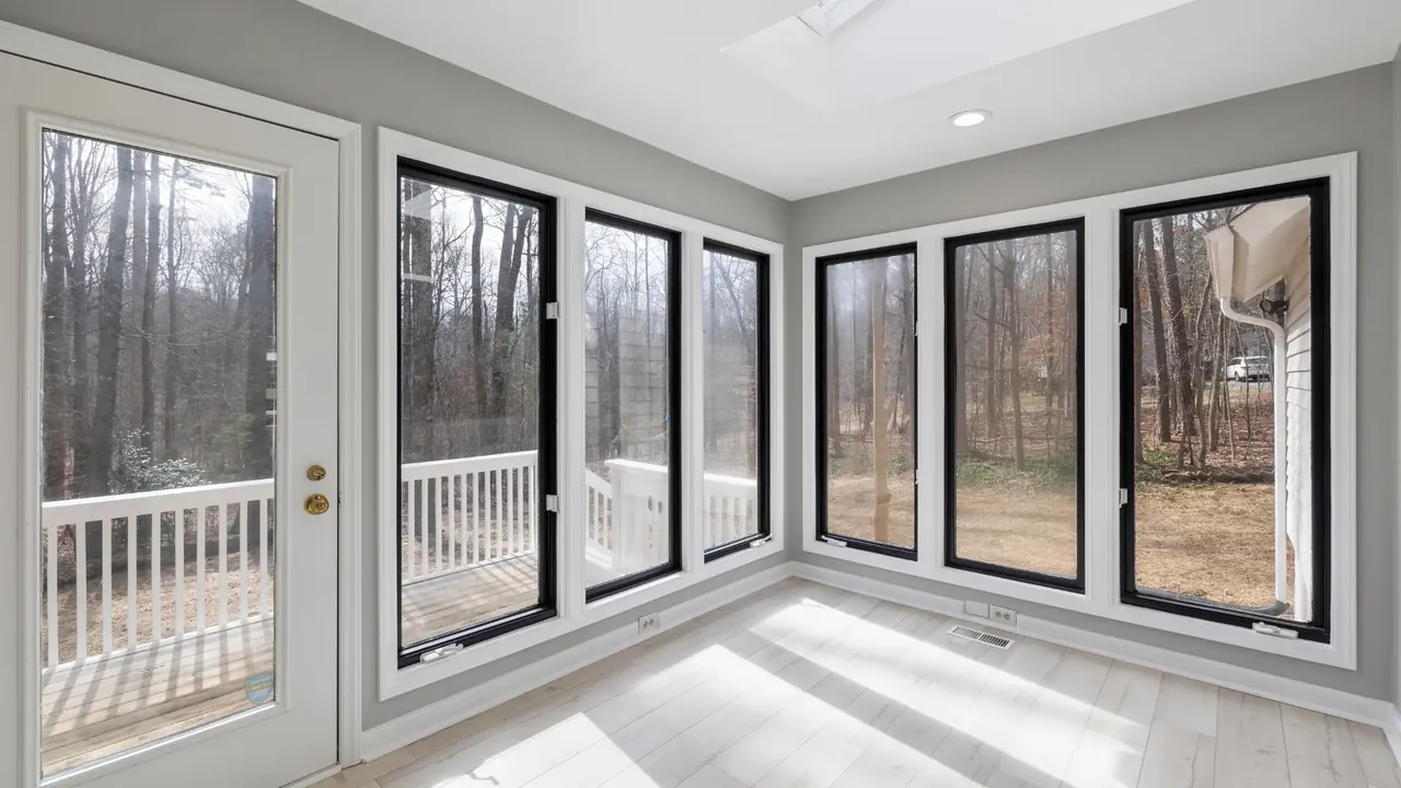 Bright conservatory with floor-to-ceiling double glazed windows