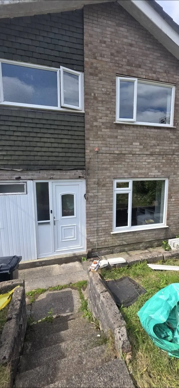 Front of a house with old windows before double glazing
