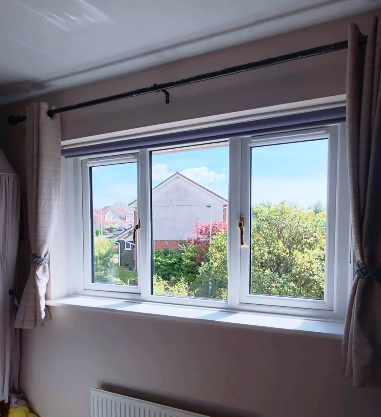 White uPVC bedroom window with curtain pole fitted